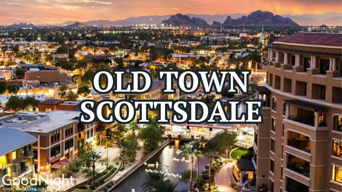 A lively scene featuring the Old Town Scottsdale sign illuminated at sunset, surrounded by bustling outdoor cafes, boutique shops, and a scenic waterway lined with lush greenery. People are strolling along the waterfront, enjoying the energetic nightlife and vibrant urban atmosphere.